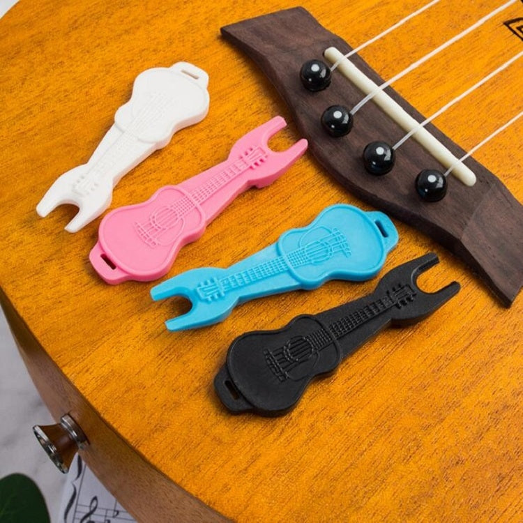 Acoustic guitar string tool kit featuring multiple colored pullers and cone holder