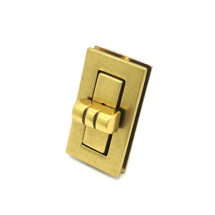 Gilt metal clasp lock hardware with rectangular frame and central latch
