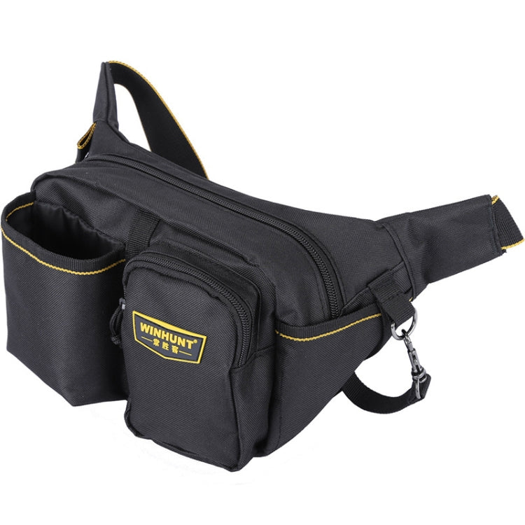 Black canvas waist tool bag with two front zip pockets, yellow stitching, and adjustable strap