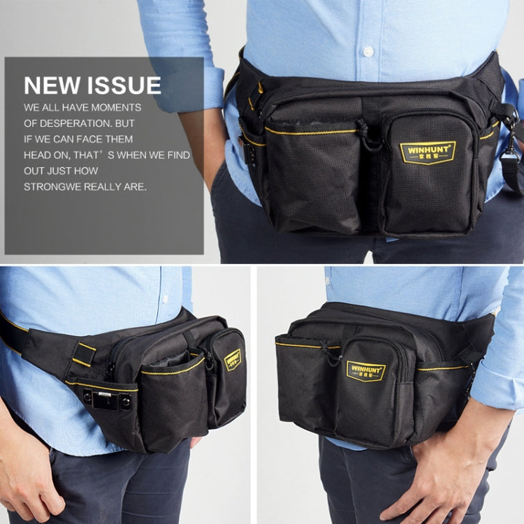Black canvas waist tool bag worn on body with front zip pocket and adjustable strap