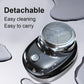 Water-resistant electric shaver with detachable head and visible water droplets.