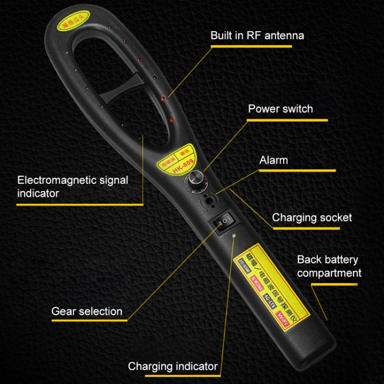 Handheld wireless signal detector highlighting buttons, charging socket, and alarm indicator
