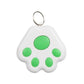 White paw-shaped pet GPS tracker keychain with green circular paw pads and metal ring