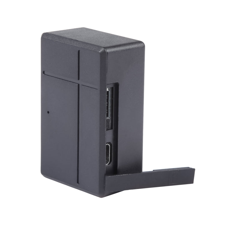Compact dark gray GPS tracker with side ports and L-shaped mounting base