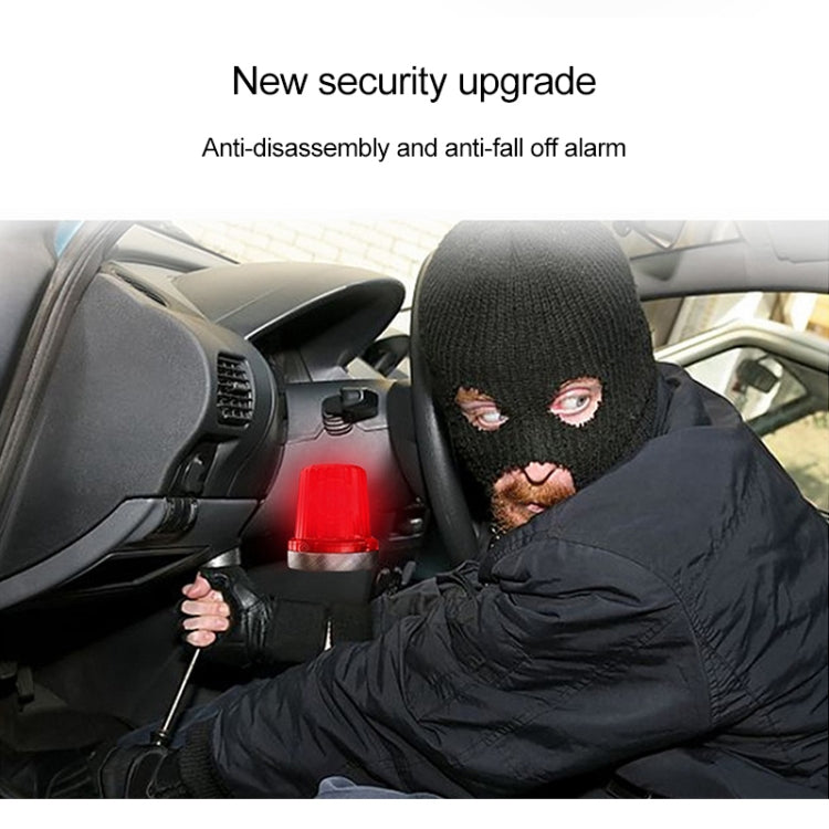 Car interior security scene with masked driver and red dashboard alarm light