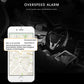 Smartphone showing GPS overspeed alert over a vehicle dashboard view