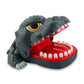 Gray dinosaur bite toy with big eye and red open jaw tray with white teeth