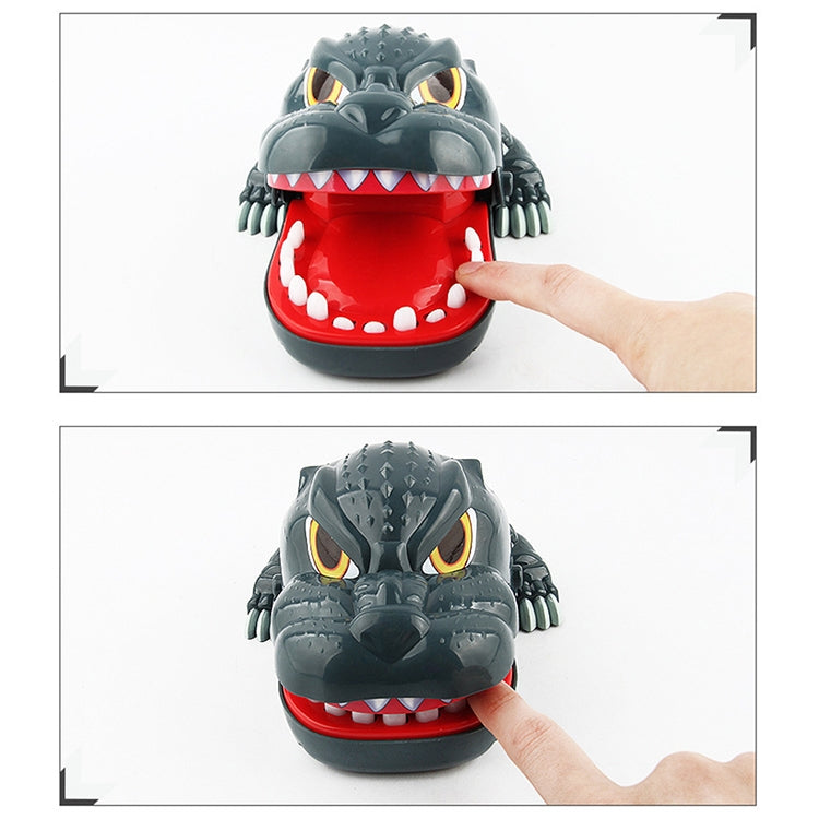 Gray dinosaur bite toy with hand pressing the red mouth, teeth visible
