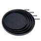Set of three black round wood trays, nested together with flat centers and raised rims