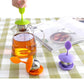 Green and purple silicone hanging tea bag strainers with stainless perforated baskets