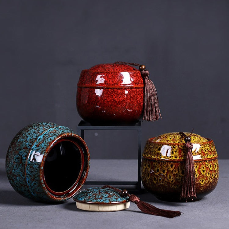 Ceramic mini tea storage set in red, teal, and yellow with tassel pulls.