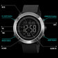 Digital outdoor wristwatch with black round case and black textured rubber strap, detailed front
