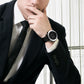 Digital outdoor wristwatch worn on a man’s wrist, black case and dark rubber strap