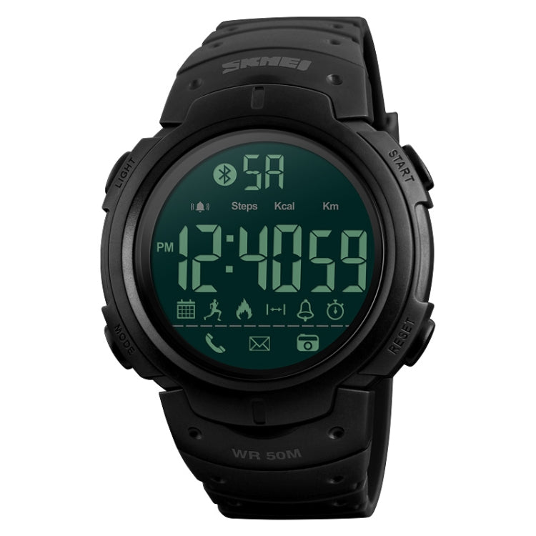 Black round digital sports watch with green backlit screen and silicone band
