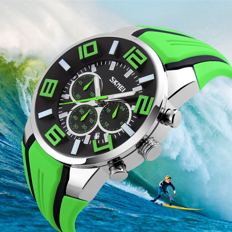 Green and black sports wristwatch with 3D multi-dial face and silicone strap