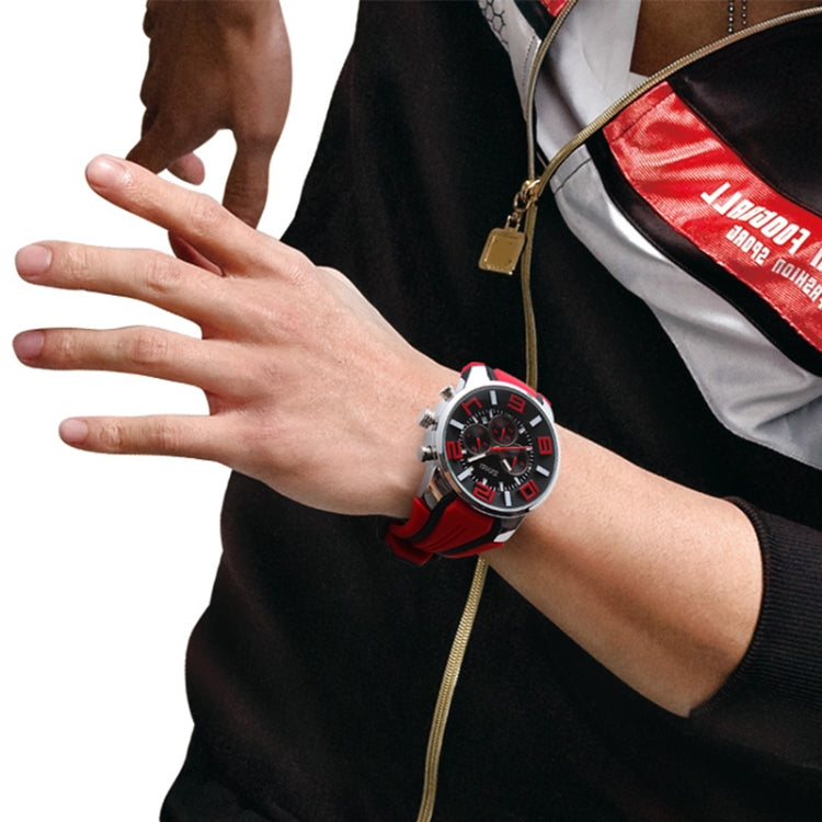 Red sports wristwatch with 3D multi-dial face on wrist, silicone strap