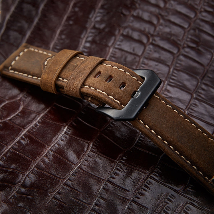 Brown leather watch band with black buckle and stitched keeper loop
