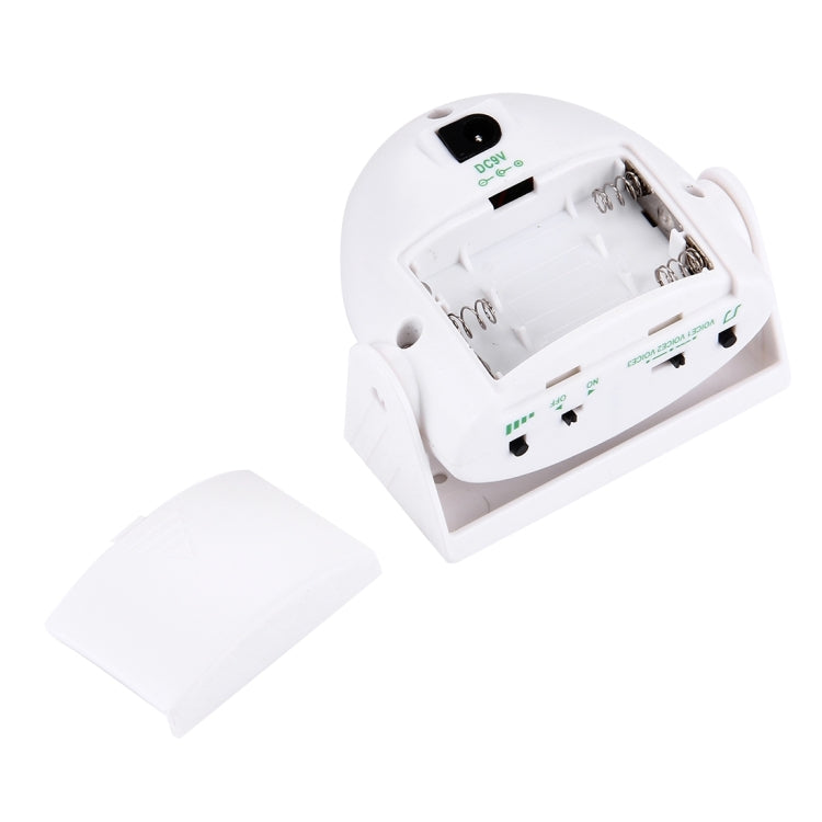 White wireless infrared doorbell with open battery compartment and included cover