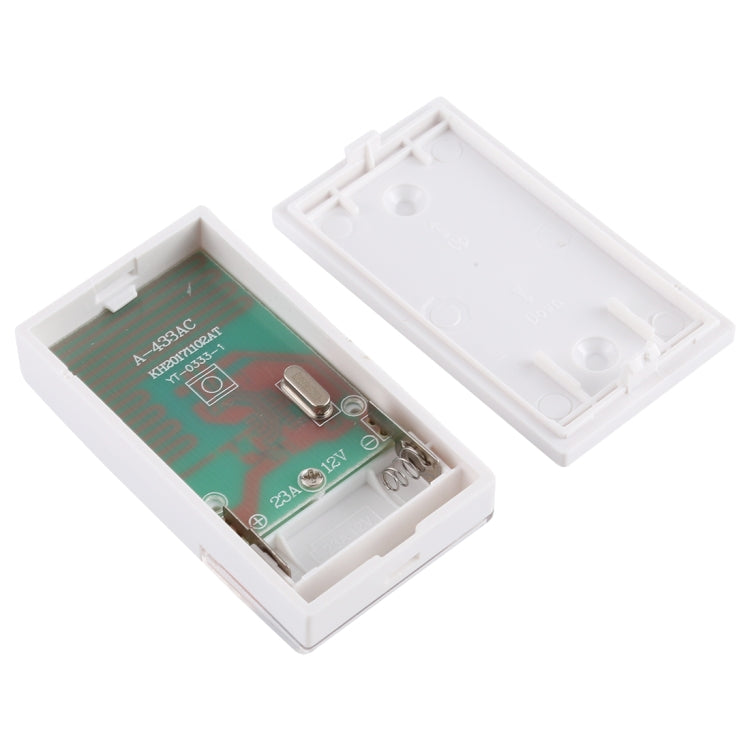 Wireless doorbell transmitter battery compartment with circuit board