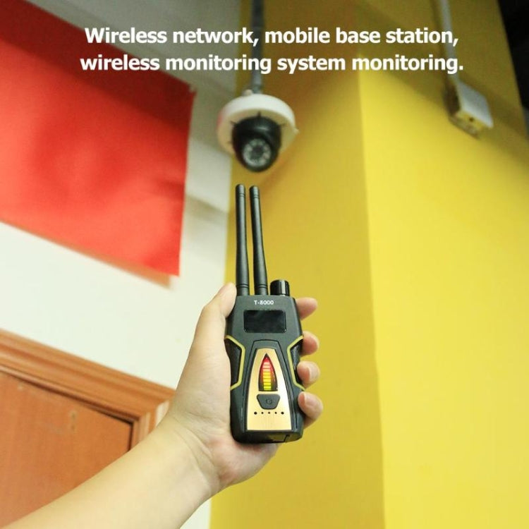 T-8000 RF signal detector held in hand with red LED and dual antennas