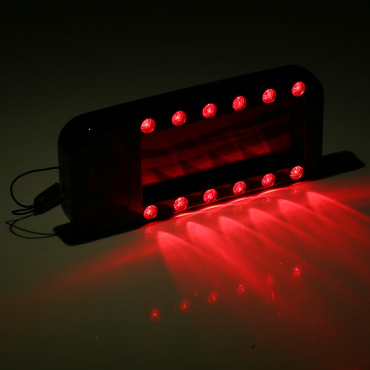 Infrared lens detector showing red LED indicator lights on the front panel
