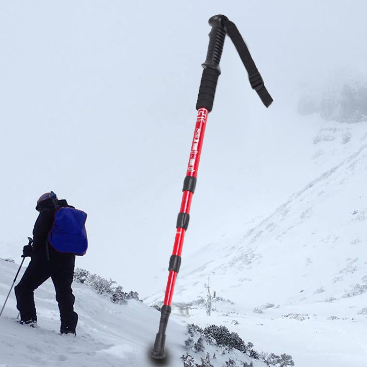 Red trekking cane with black grip, wrist strap, and four-section straight shaft
