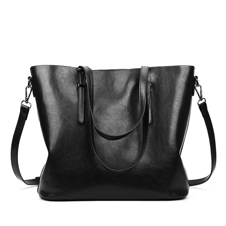 Black PU shoulder bag with curved front panel, drawstring-style pull tab, and side straps