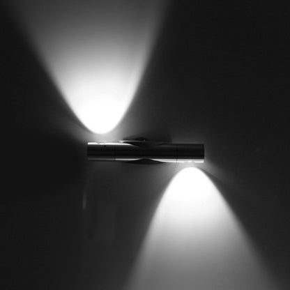 Rotating LED wall lamp emitting two bright light beams