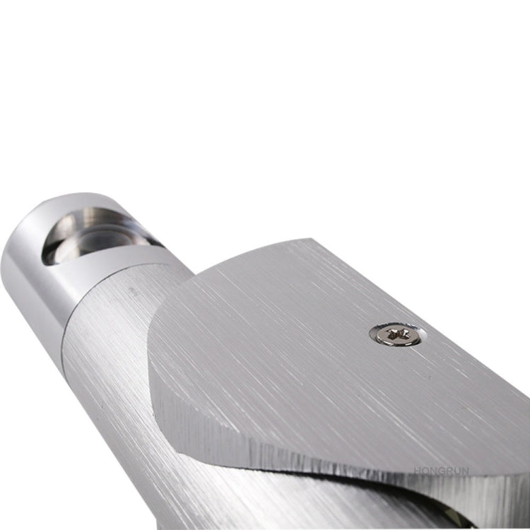 Close-up of brushed metal LED wall lamp bracket and swiveling light housing