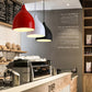 Red, white, and black modern pendant lamps with bell-shaped shades