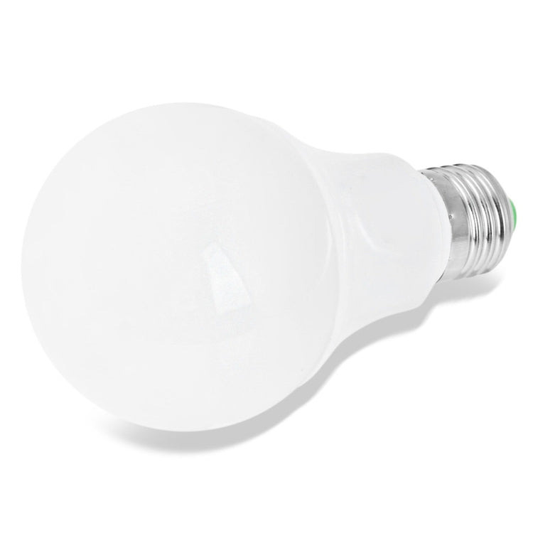 White LED light bulb with E27 screw base, angled side view