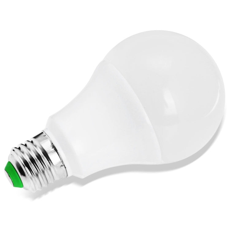 White LED light bulb with E27 screw base, close-up from the side