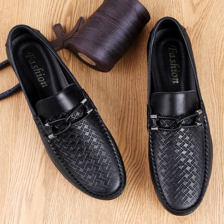 Men's black round-toe leather loafers with embossed textured panels and lace-up detail