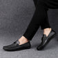 Men's black leather loafers with round toe and lace-up strap detail, side view