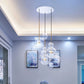 Glass ball chandelier with clear globe shades and gold hanging stems on ceiling
