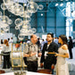 Modern glass ball chandelier with clear spheres and gold hanging rods