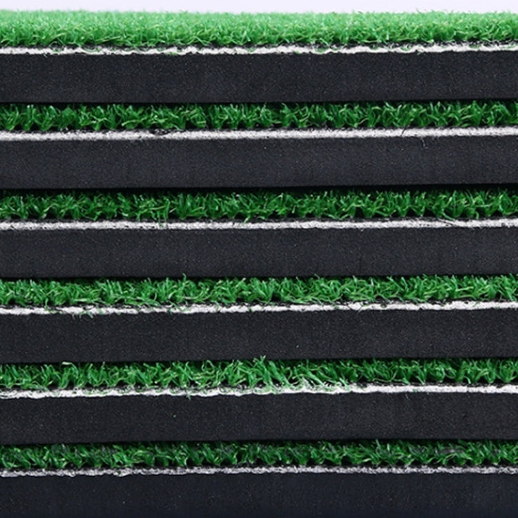 Stacked mat layers with green turf surface and black foam padding