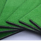 Corner of green turf mat with stitched base and three guide slots