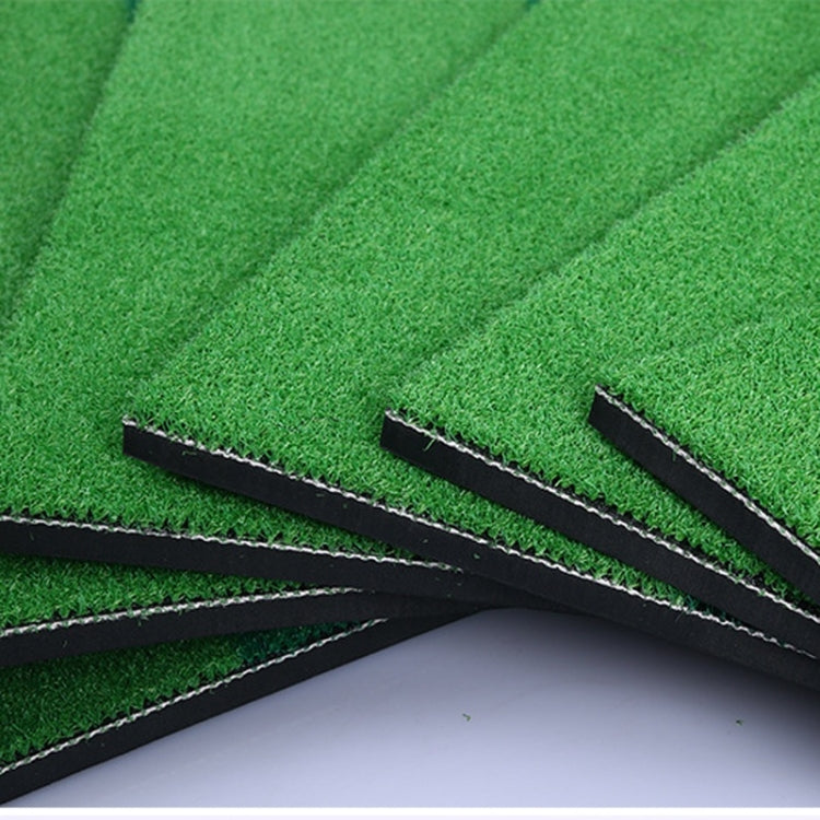 Corner of green turf mat with stitched base and three guide slots