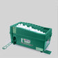 Green indoor golf ball machine showing open tray of white balls, front-left angle