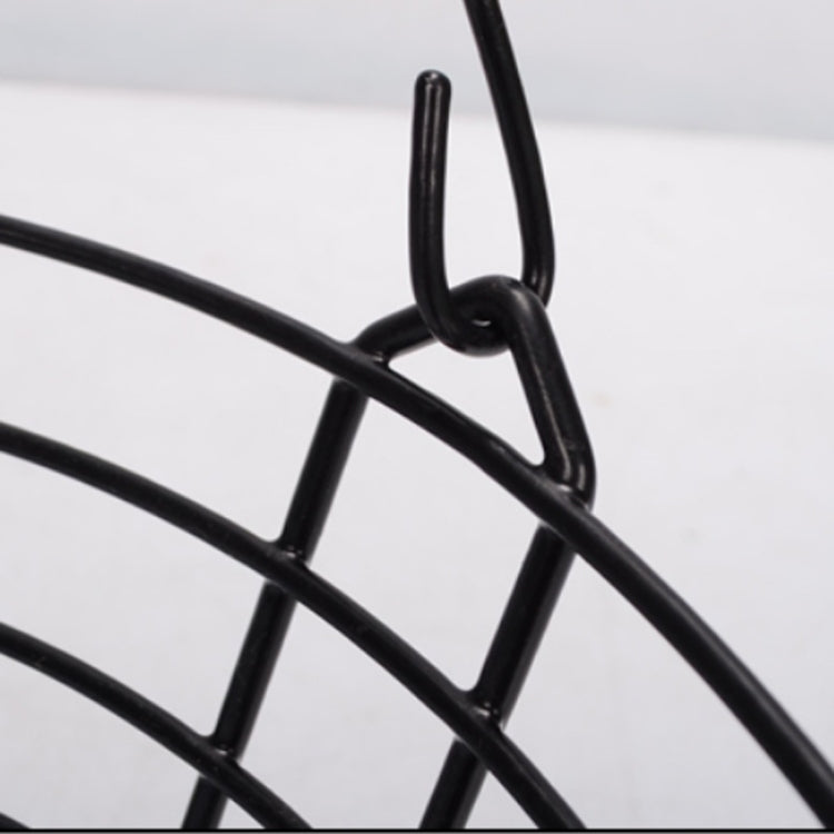 Close-up of black wire basket frame and metal ring connection