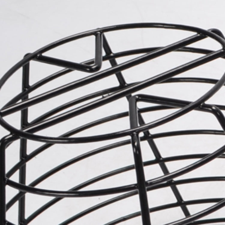 Close-up of black wire basket frame with arched top supports