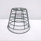 Green wire golf ball basket with rounded sides and open top