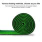 Rolled green turf practice mat with spiral pattern and black outer backing