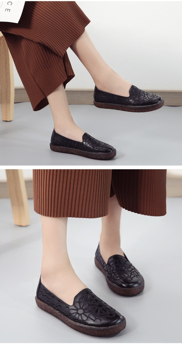 Women's black embroidered slip-on casual shoes, shown from side and front views.