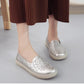 Women's white embroidered slip-on shoes, floral design on side and toe area