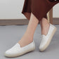Women's white embroidered slip-on shoes, floral side pattern and low cushioned sole