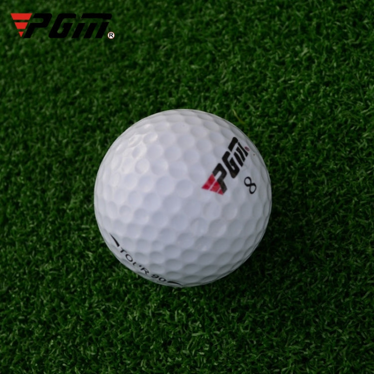 Three-layer white golf ball with PGM logo on green turf