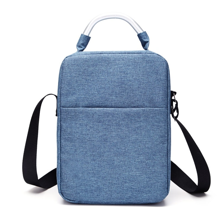 Blue fabric rectangular shoulder case bag with top handle and wide crossbody strap.