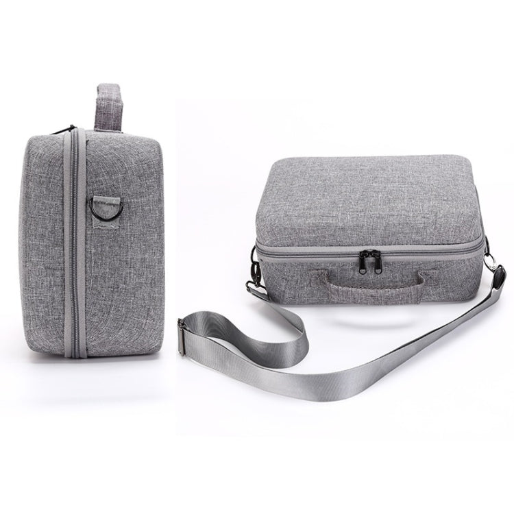 Gray travel carry case with shoulder strap and matching smaller organizer pouch.